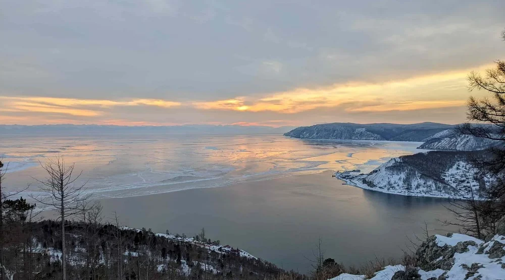Panoramic view of frozen Lake Baikal near Listvyanka at sunset
