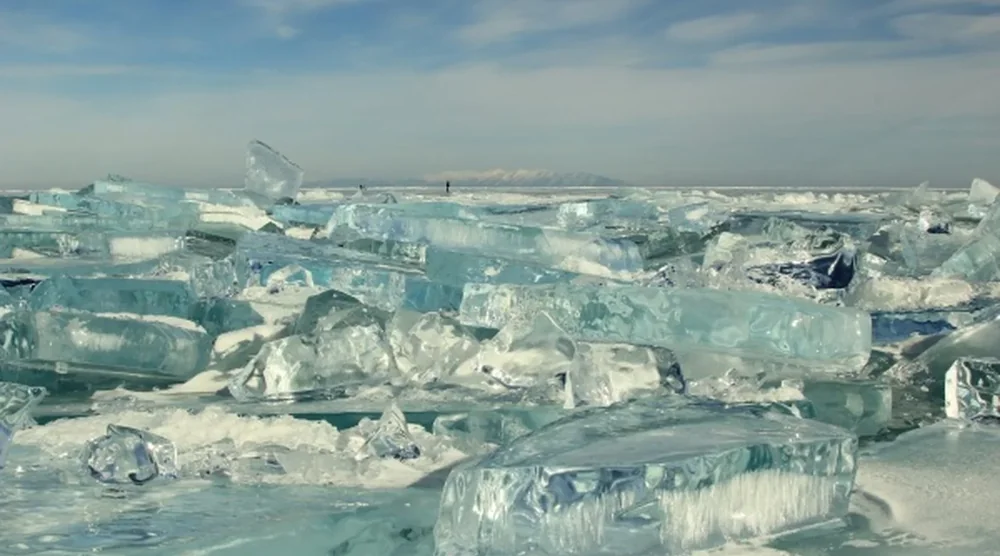 Large chunks of clear blue ice on Lake Baikal during a winter tour