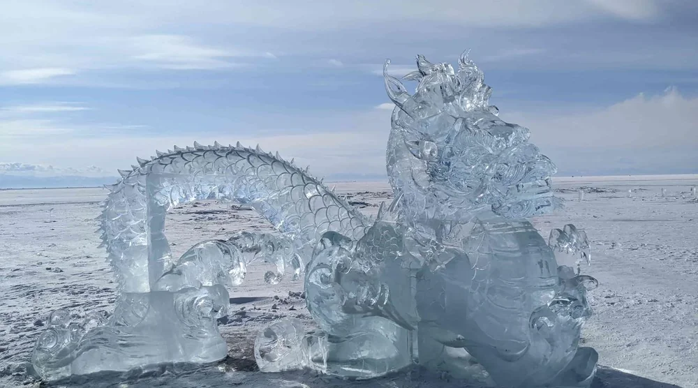 Intricate ice sculpture of a dragon on the frozen surface of Lake Baikal