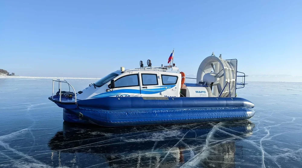 Hovercraft riding on the frozen surface of Lake Baikal during a winter tour
