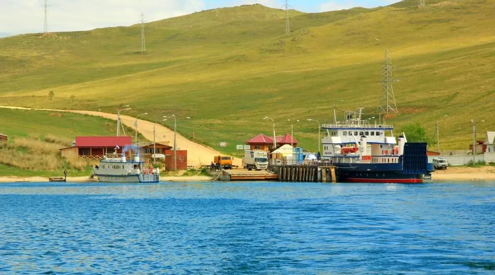 Ferry boat and passenger vessel at the pier near Olkhon Island on Lake Baikal
