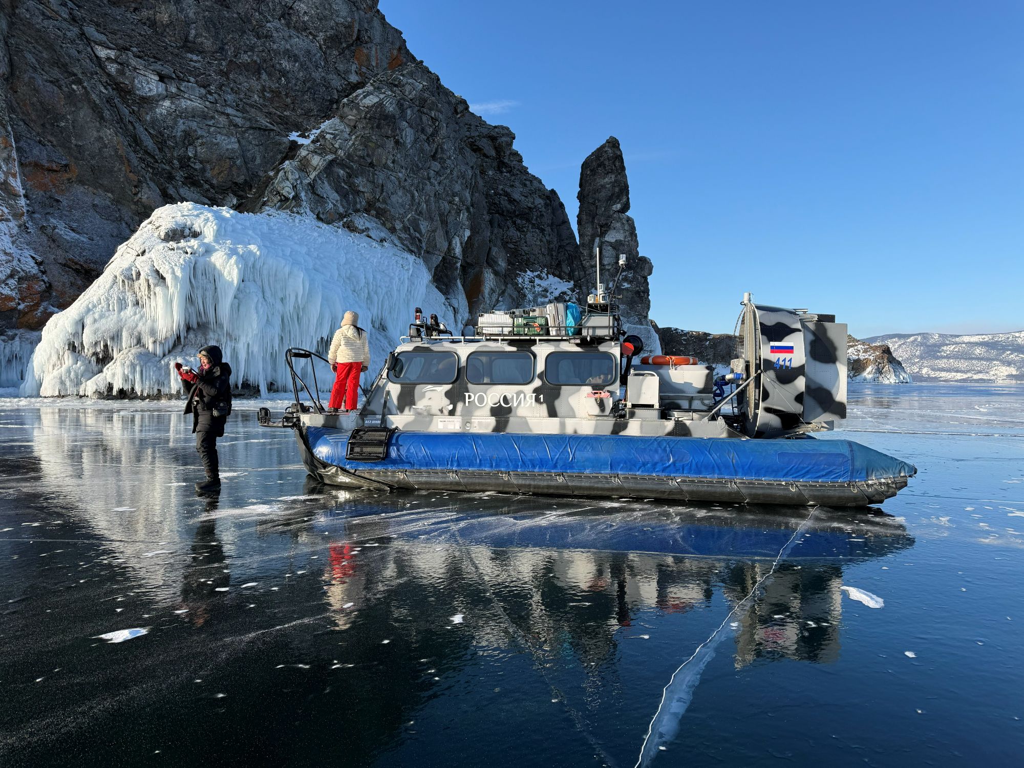 Hivus air-cushion hovercraft crossing the frozen surface of Lake Baikal near Olkhon Island in winter
